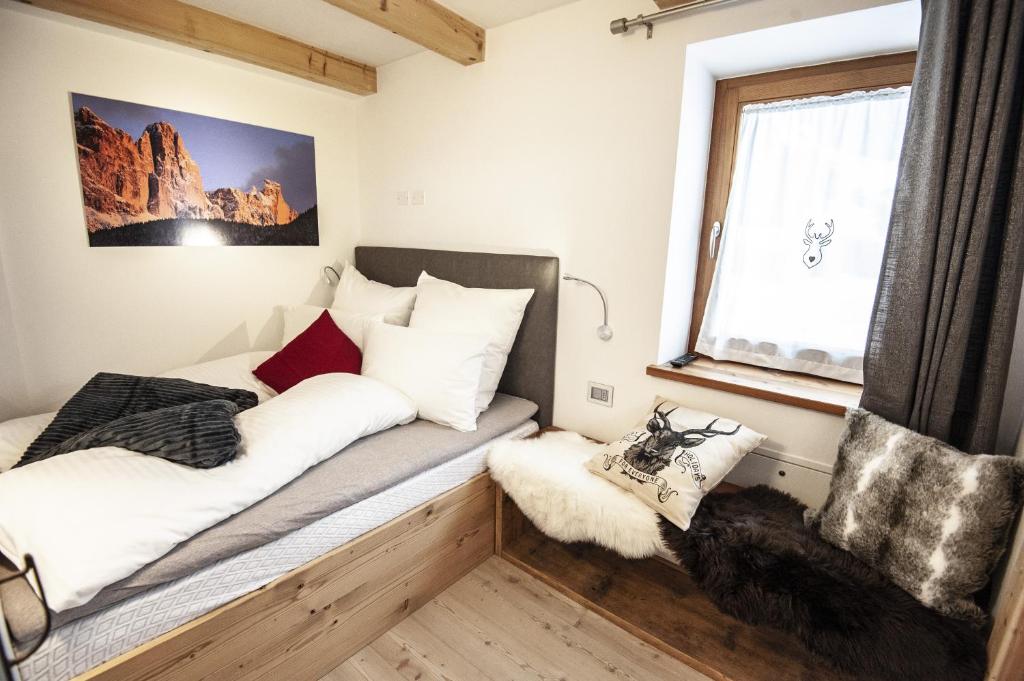 Posteľ alebo postele v izbe v ubytovaní Chalet Tobià