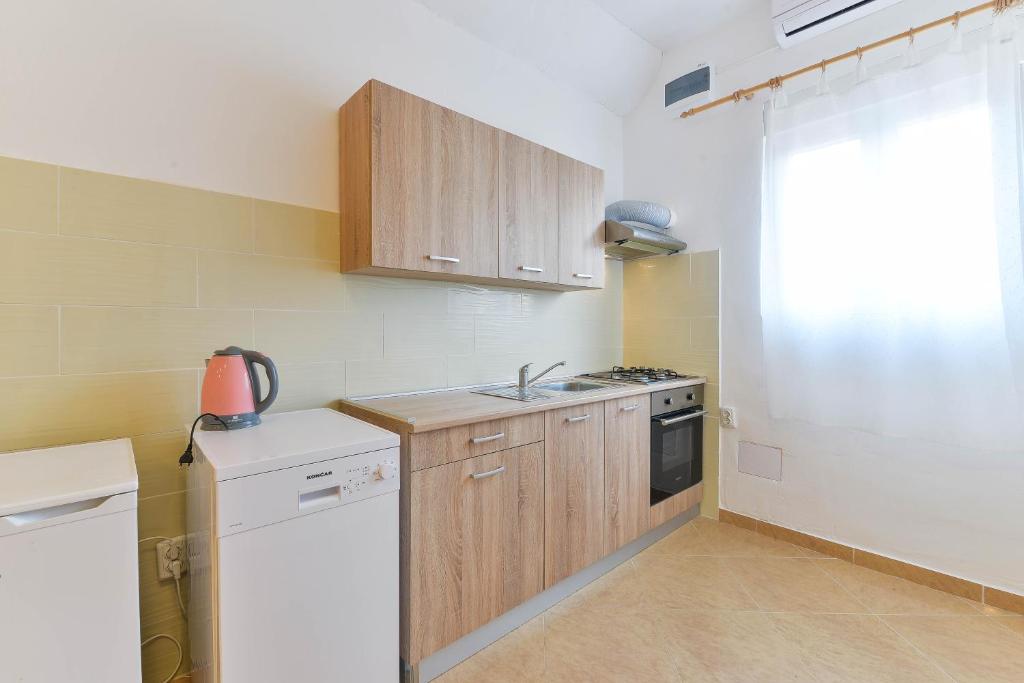 Kuchyň nebo kuchyňský kout v ubytování Apartments Lavanda