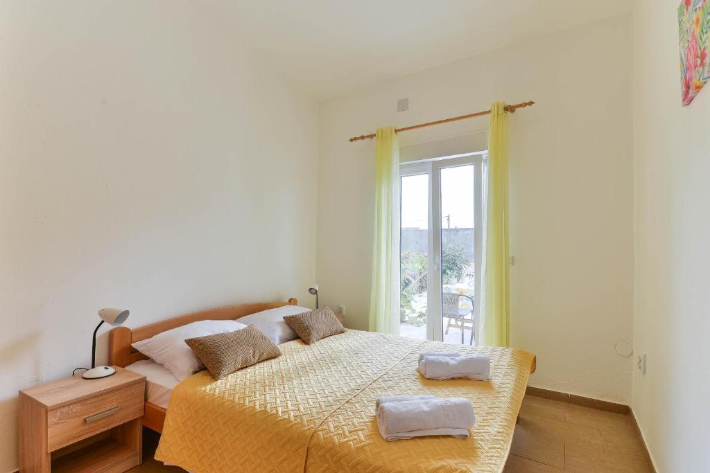 Postel nebo postele na pokoji v ubytování Apartments Lavanda