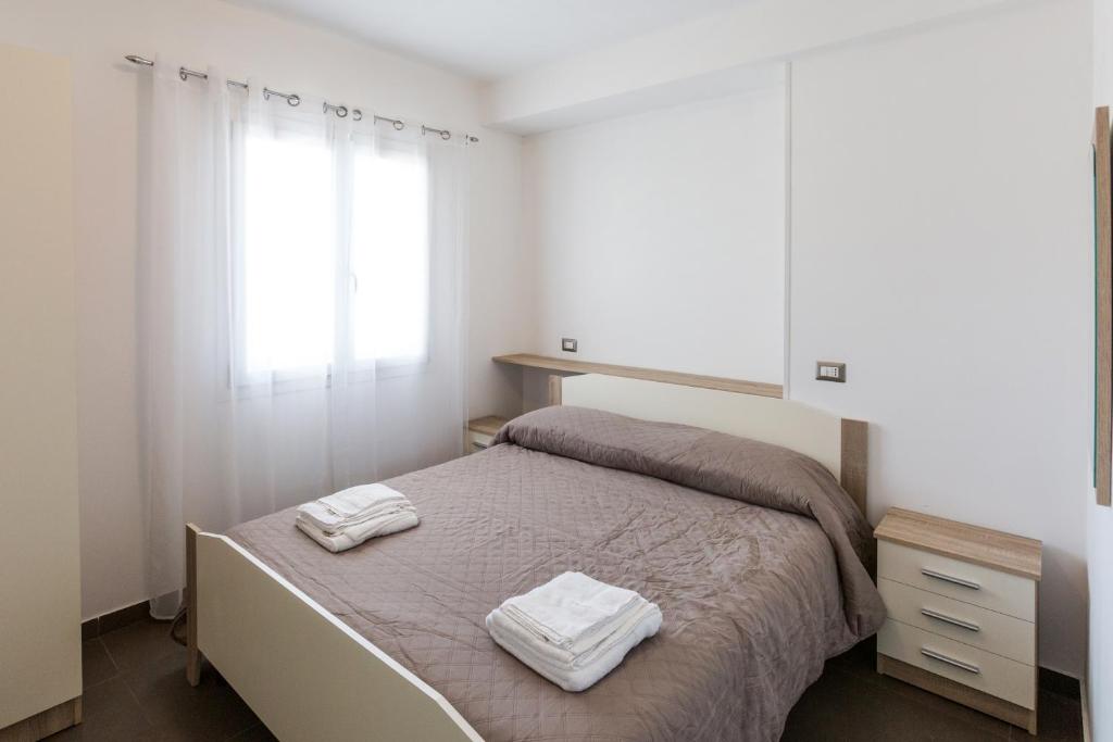 Postel nebo postele na pokoji v ubytování Spuma di mare