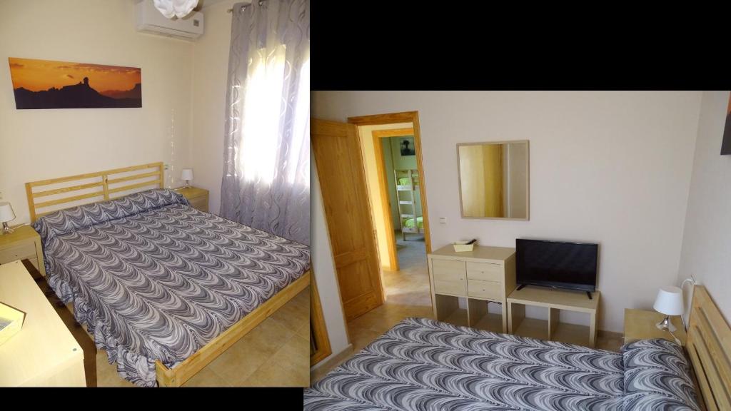 Łóżko lub łóżka w pokoju w obiekcie Playa Eucaliptos 1A