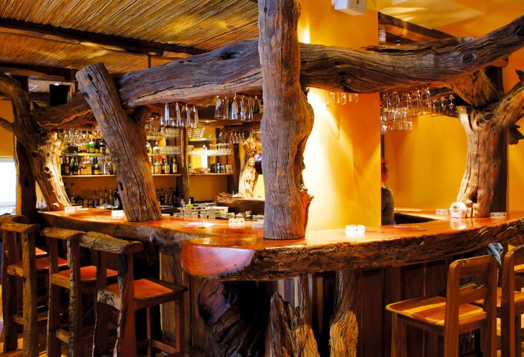 a bar made out of logs in a restaurant at Hotel Hottentotten in Regensburg