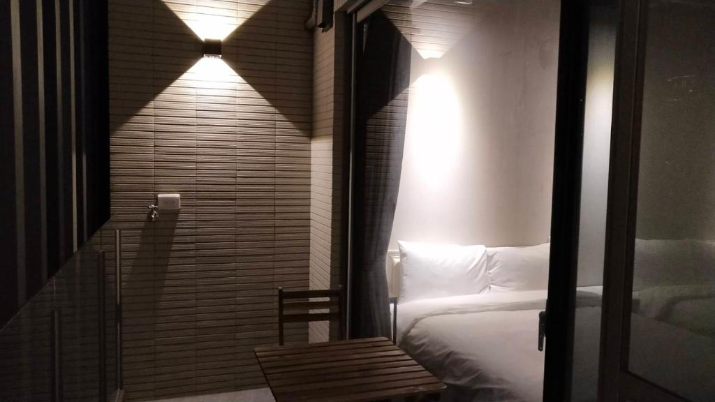 Postel nebo postele na pokoji v ubytování 駐駐逢甲 Shine Residence