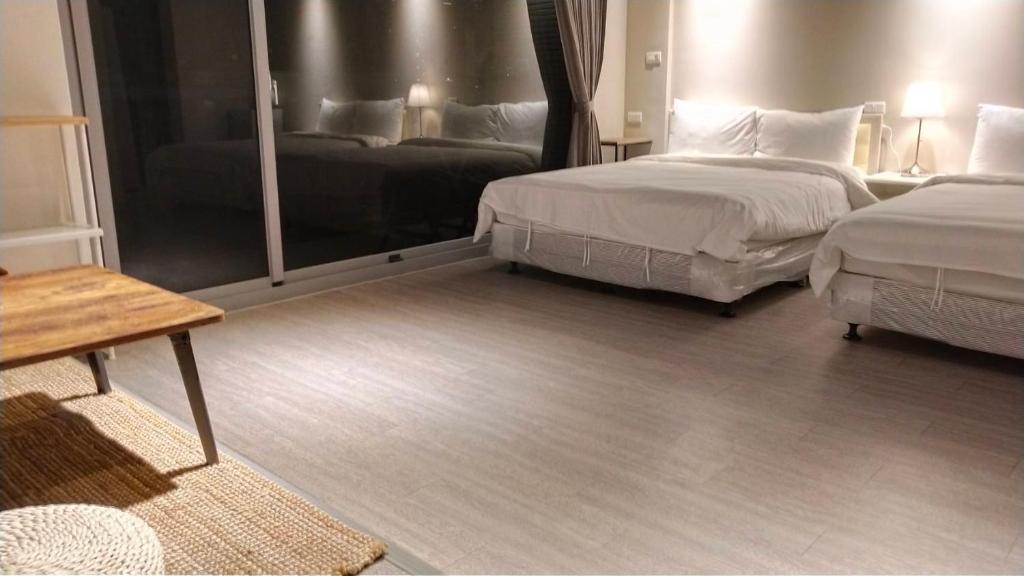 Postel nebo postele na pokoji v ubytování 駐駐逢甲 Shine Residence