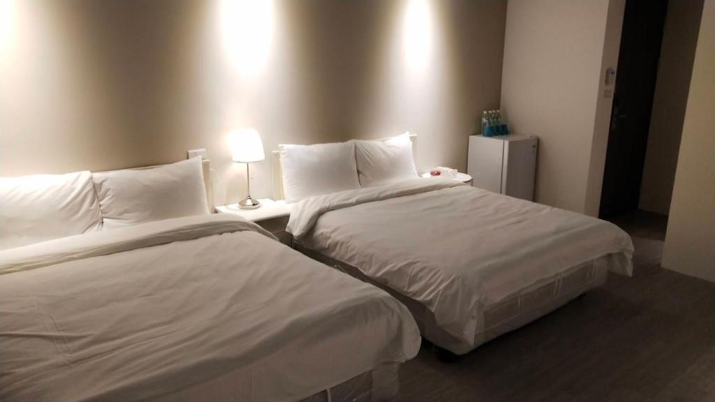 Postel nebo postele na pokoji v ubytování 駐駐逢甲 Shine Residence