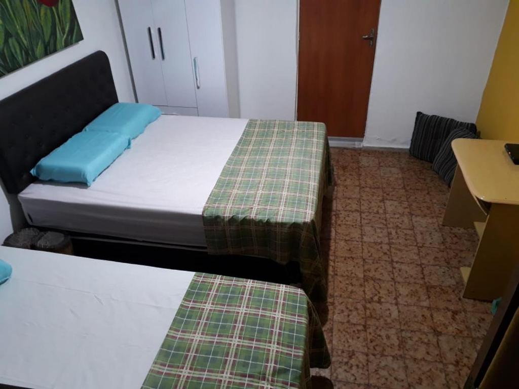 Ένα ή περισσότερα κρεβάτια σε δωμάτιο στο Hostel Gerais
