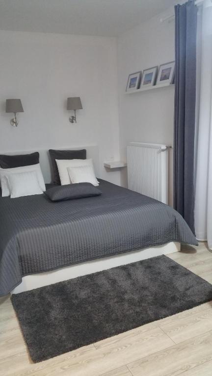 Łóżko lub łóżka w pokoju w obiekcie Dom Przy Plaży