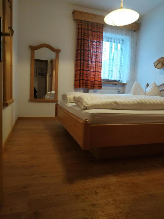 Postel nebo postele na pokoji v ubytování Apartment Antholzersee