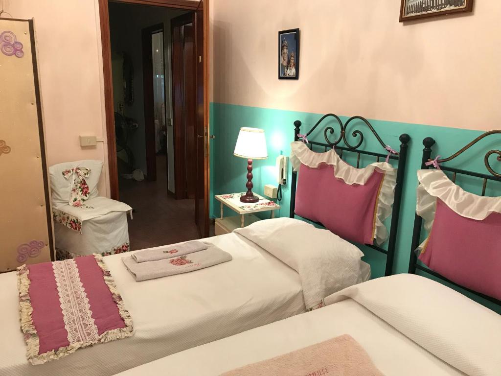 Łóżko lub łóżka w pokoju w obiekcie Affittacamere San Marco