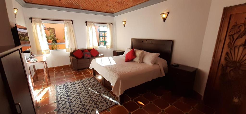 Postel nebo postele na pokoji v ubytování Casa Frida B&B