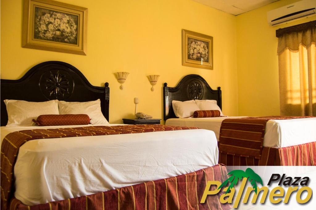 Postel nebo postele na pokoji v ubytování Hotel Plaza Palmero