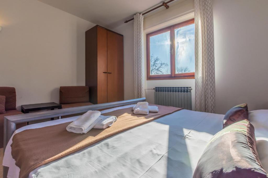 Postel nebo postele na pokoji v ubytování Apartment Roni