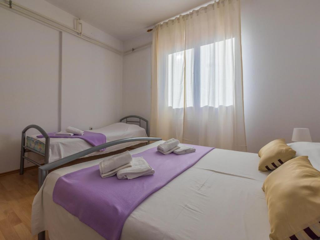 Postel nebo postele na pokoji v ubytování Apartment Roni