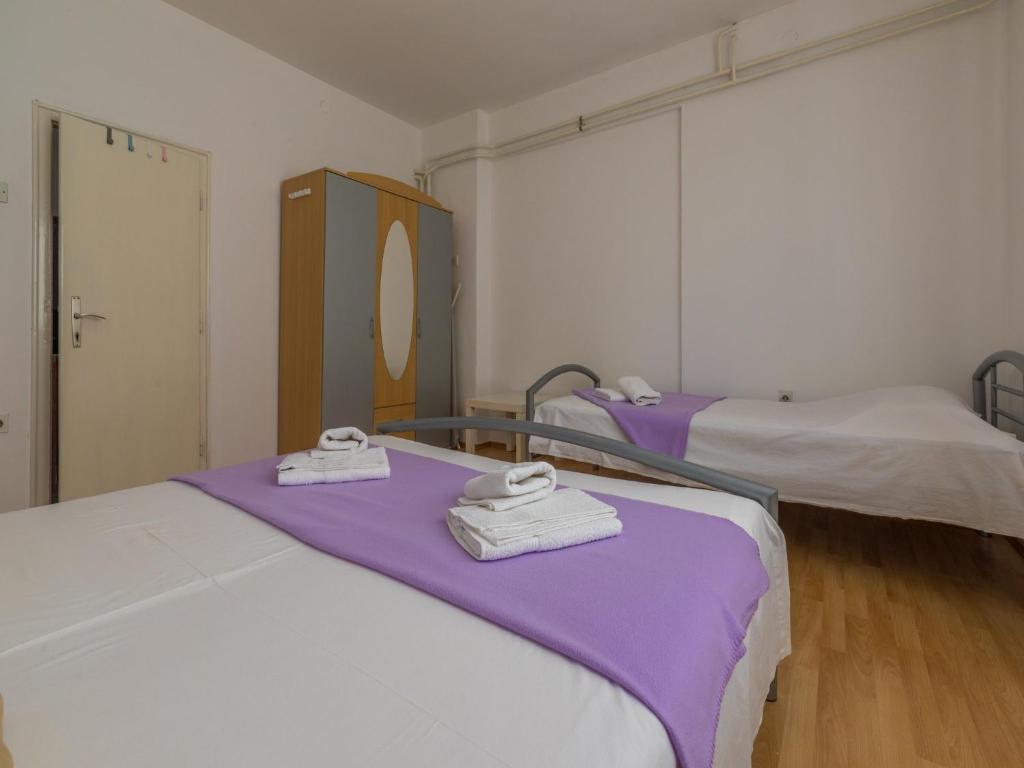 Postel nebo postele na pokoji v ubytování Apartment Roni
