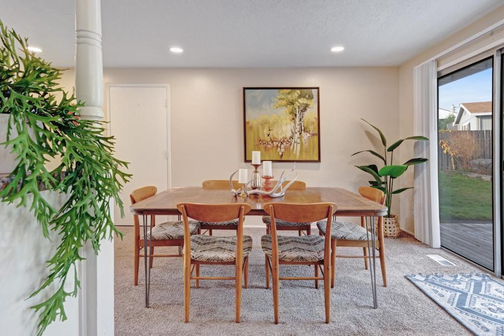 a dining room with a wooden table and chairs at Home in the Silicon Forest in Beaverton