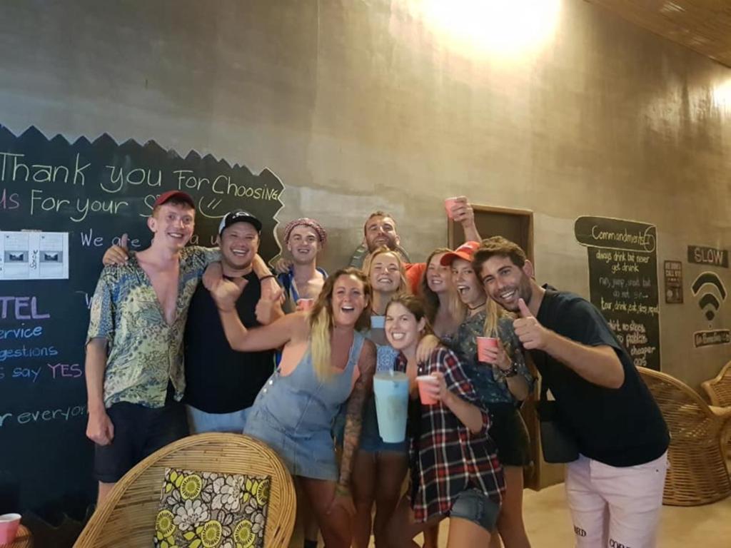 a group of people posing for a picture at Big Paul Hostel in El Nido