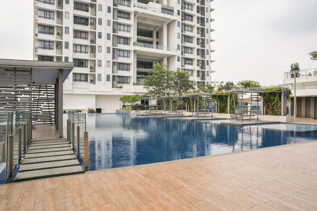 a swimming pool in front of a building at USJ One Premium Suites @Subang @Sunway @USJ in Subang Jaya