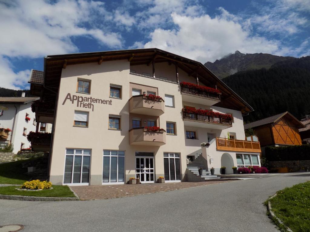 a large white building with a sign on it at Appartement Prieth in Resia
