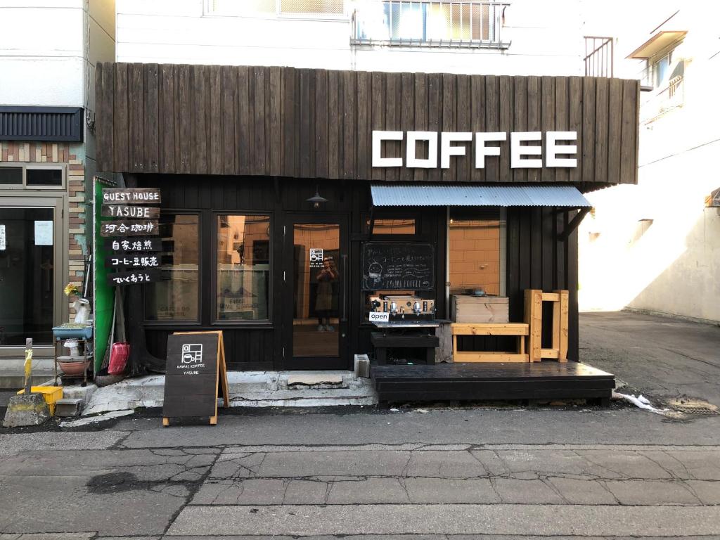 a coffee shop on the side of a street at Guest House Yasube in Sapporo