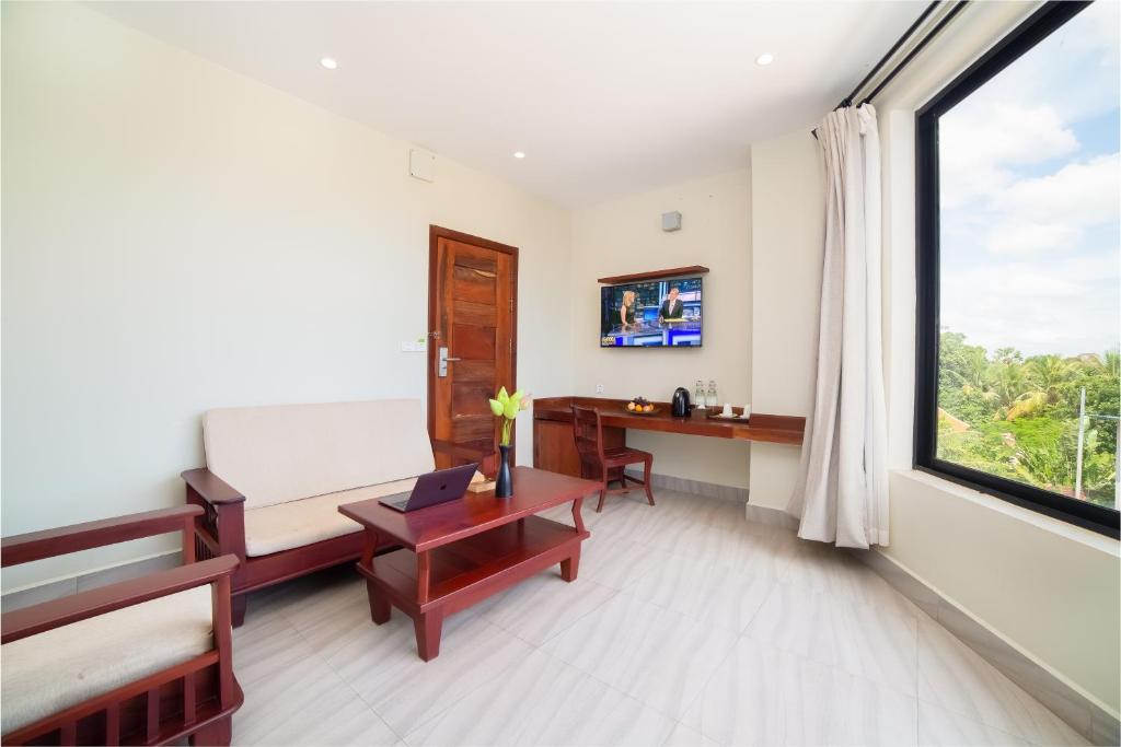 TV a/nebo společenská místnost v ubytování Bayon Modern Residence