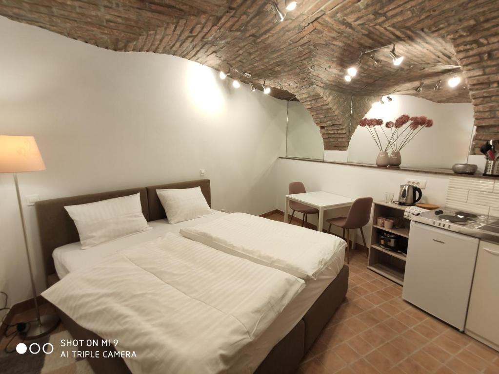 Kuchyň nebo kuchyňský kout v ubytování Aparthotel Cross Street 4