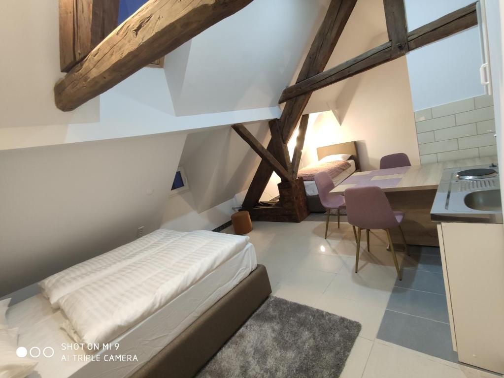 Postel nebo postele na pokoji v ubytování Aparthotel Cross Street 4