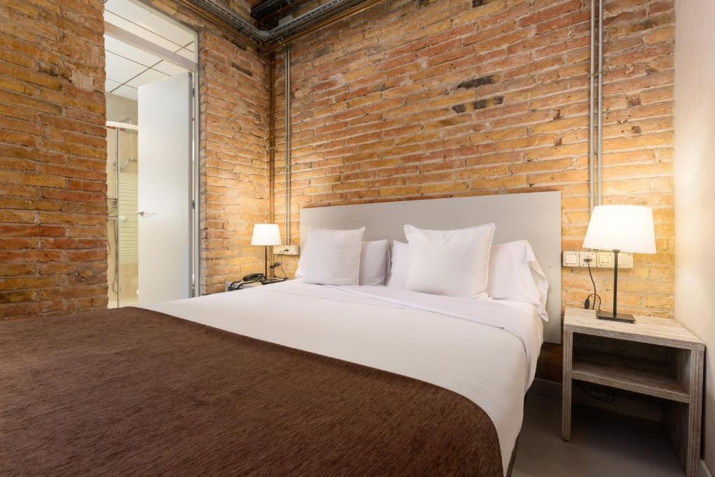 Postel nebo postele na pokoji v ubytování Apartamentos DV