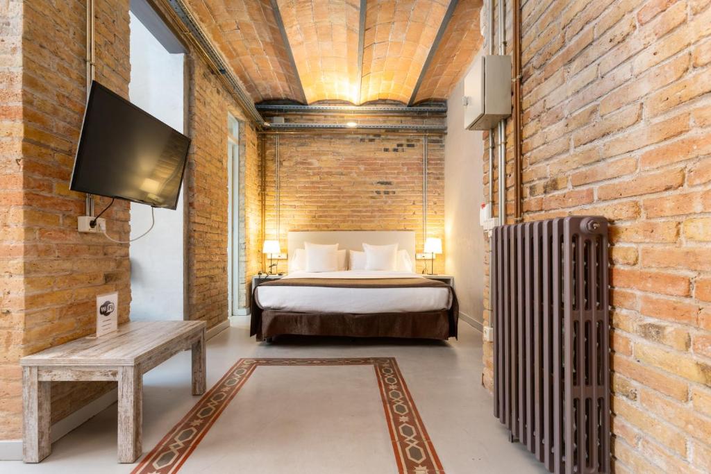 Postel nebo postele na pokoji v ubytování Apartamentos DV