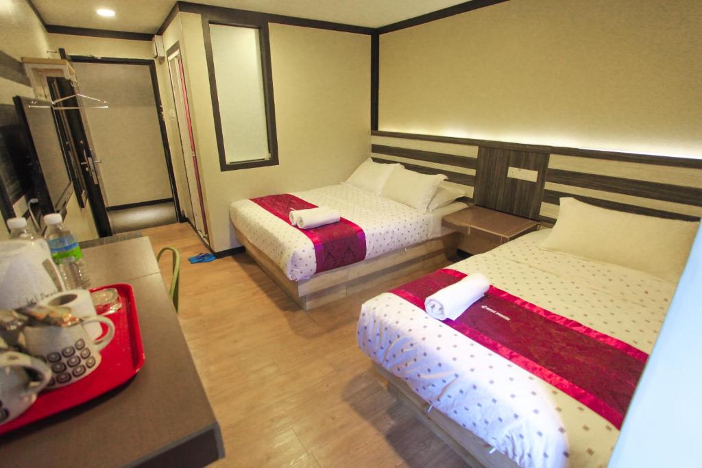 Кровать или кровати в номере HOTEL PREMIUM