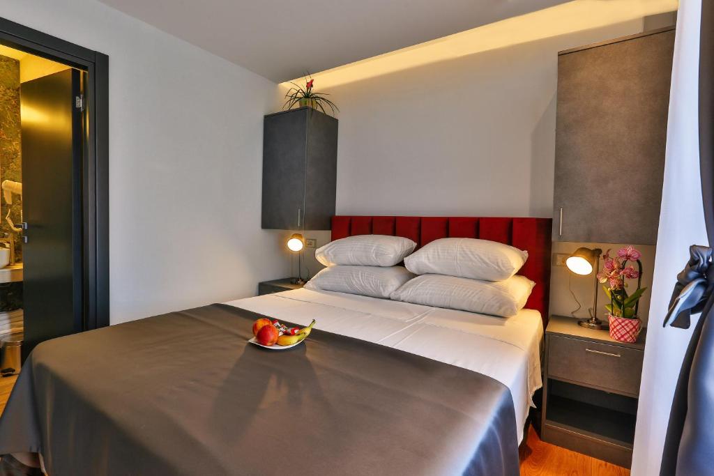 Postel nebo postele na pokoji v ubytování Hotel M