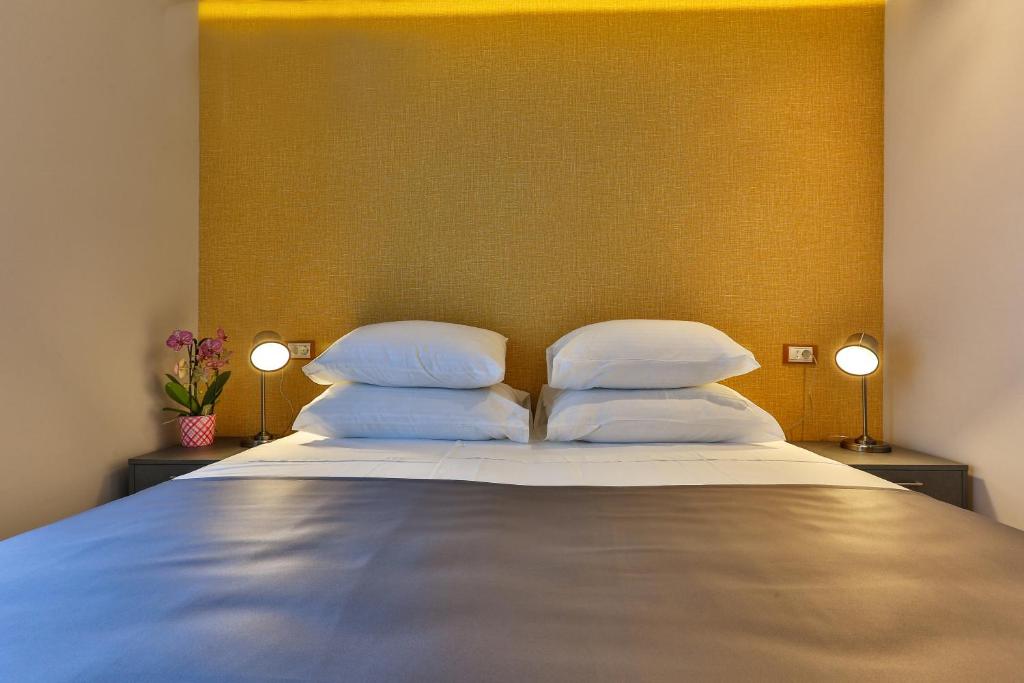 Postel nebo postele na pokoji v ubytování Hotel M