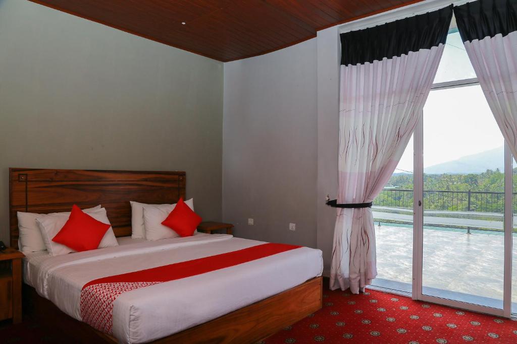 Postel nebo postele na pokoji v ubytování OYO 278 Hotel Rivelka