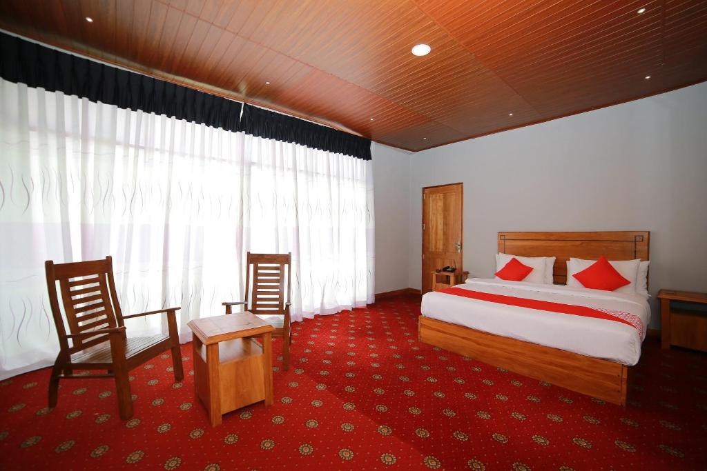 Postel nebo postele na pokoji v ubytování OYO 278 Hotel Rivelka