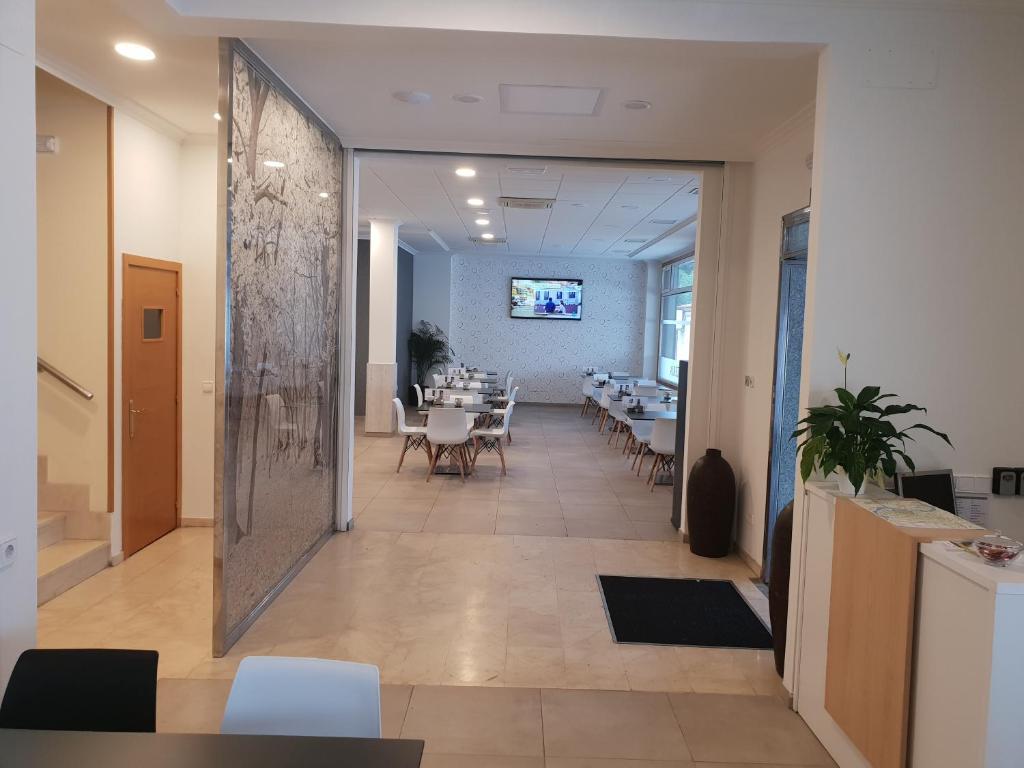 TV a/nebo společenská místnost v ubytování Hotel Reigosa