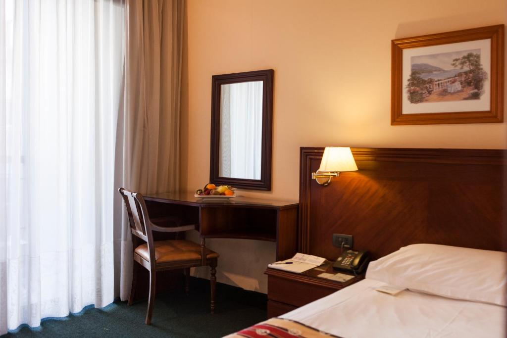 Postel nebo postele na pokoji v ubytování The Mayflower Hotel