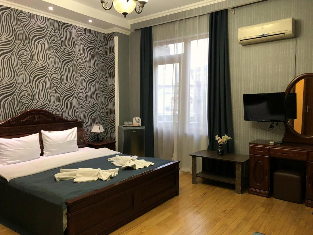 Postel nebo postele na pokoji v ubytování Bonus Hotel