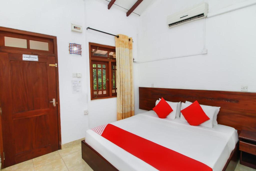 Ένα ή περισσότερα κρεβάτια σε δωμάτιο στο Airport Green View Resort