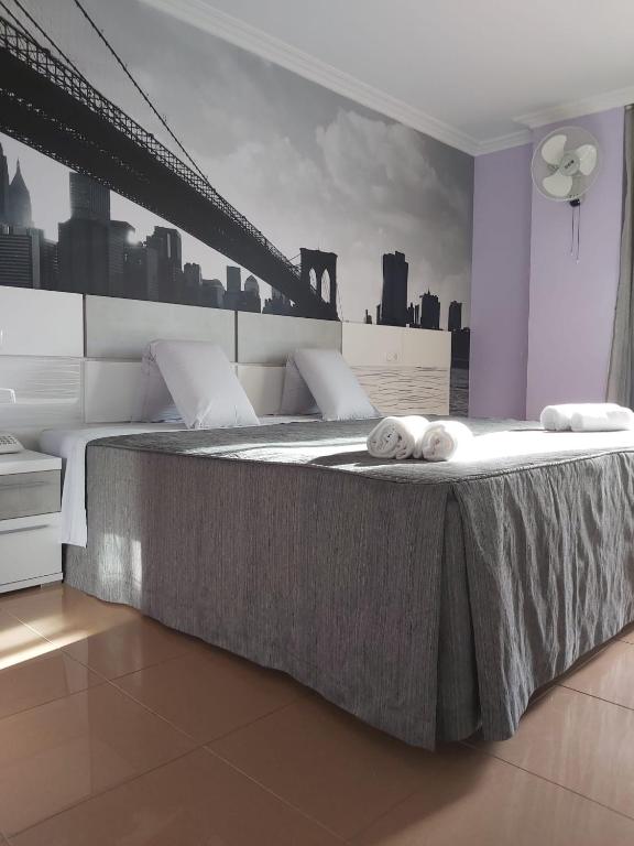 Postel nebo postele na pokoji v ubytování Hotel Reigosa