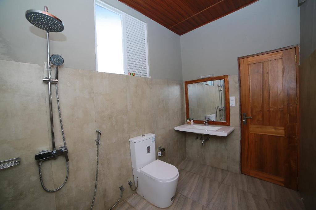 Koupelna v ubytování OYO 278 Hotel Rivelka