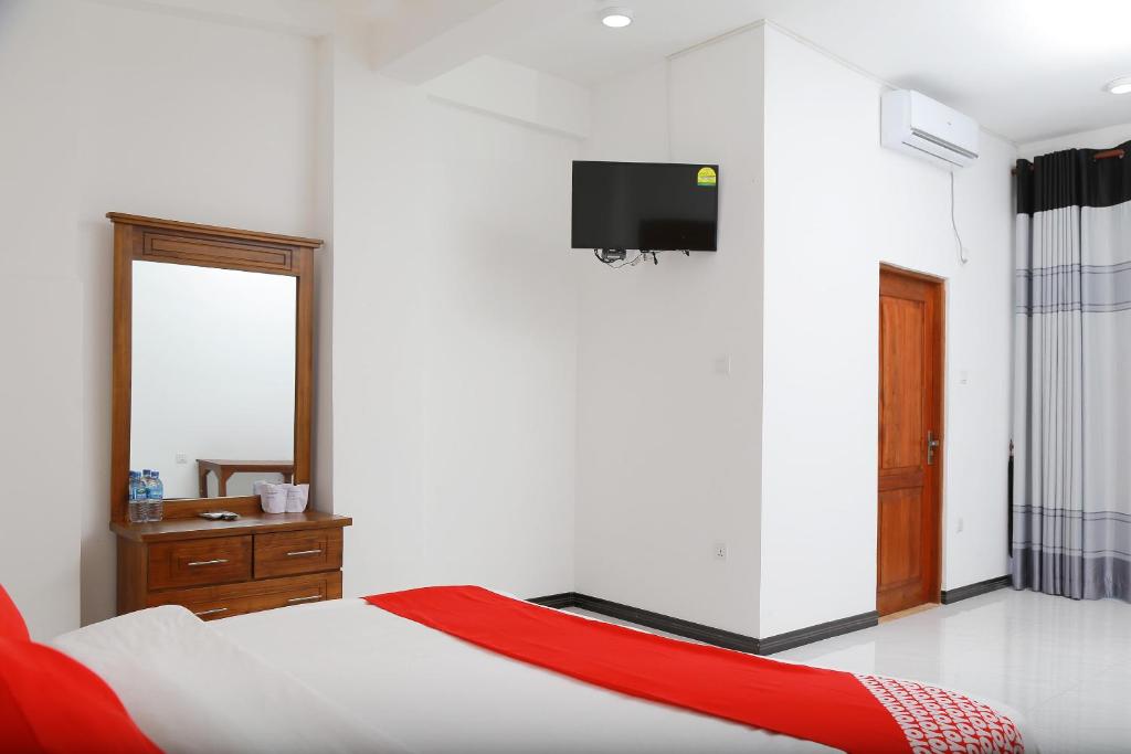 Postel nebo postele na pokoji v ubytování OYO 278 Hotel Rivelka