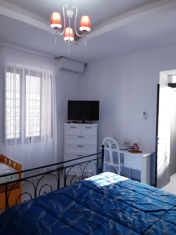 Łóżko lub łóżka w pokoju w obiekcie Casa Ary