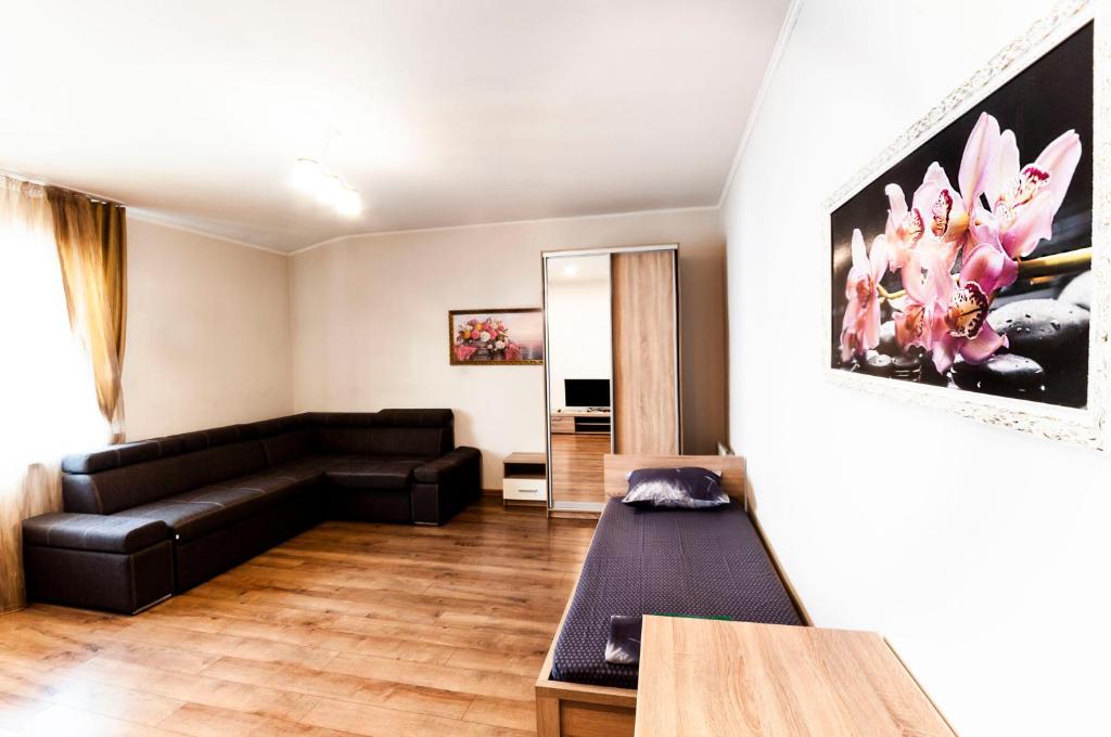 a living room with a couch and a table at Wonderful flat on city center (Mukachivska 4/21) in Uzhhorod