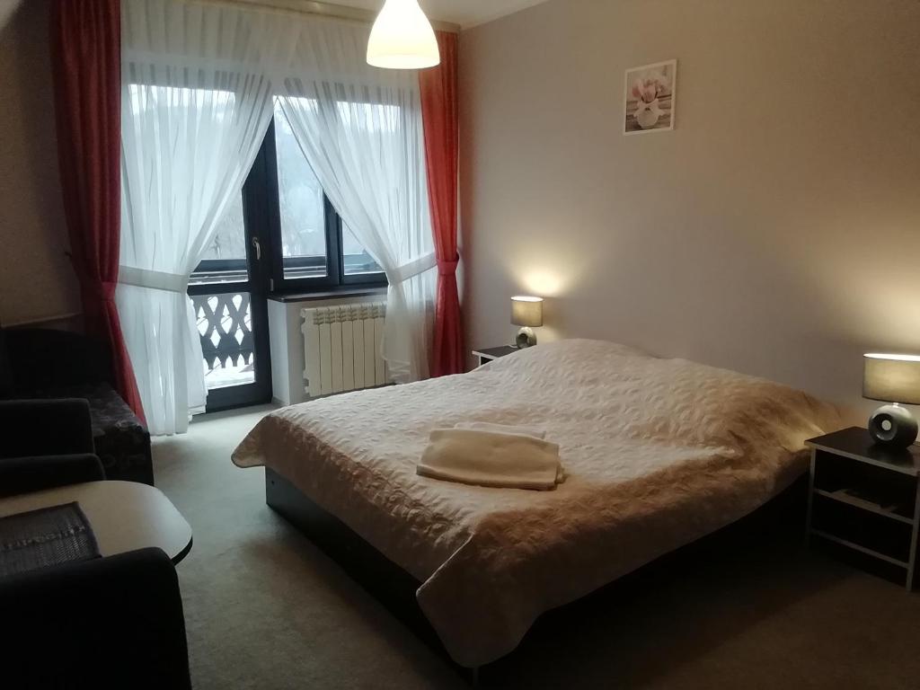 Postel nebo postele na pokoji v ubytování Willa Hamernik