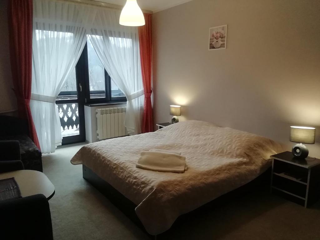 Postel nebo postele na pokoji v ubytování Willa Hamernik