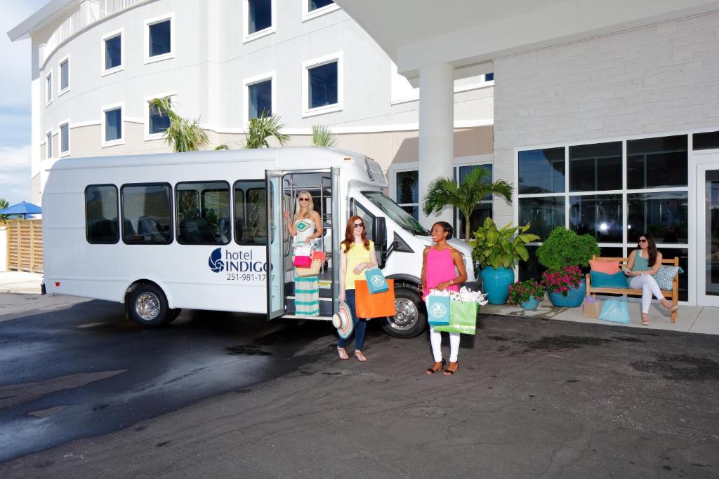 three women standing in front of a food truck at Hotel Indigo Orange Beach - Gulf Shores by IHG in Gulf Shores