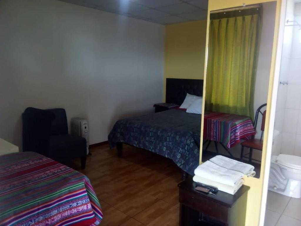 Postel nebo postele na pokoji v ubytování Misti Hostel B&B