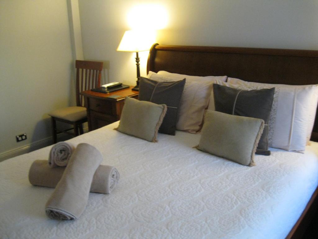 Postel nebo postele na pokoji v ubytování Heritage Guesthouse