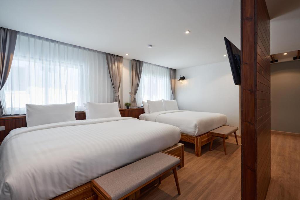 Postel nebo postele na pokoji v ubytování P2 Wood Loft