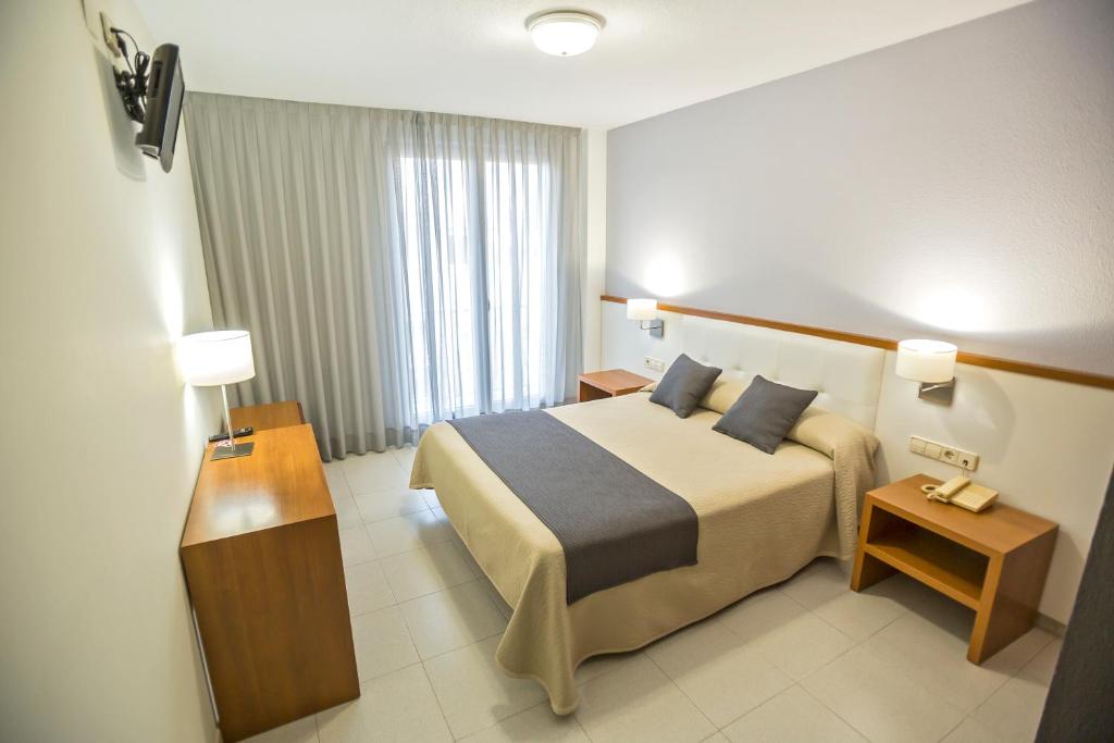 Cama o camas de una habitación en Hotel Teruel