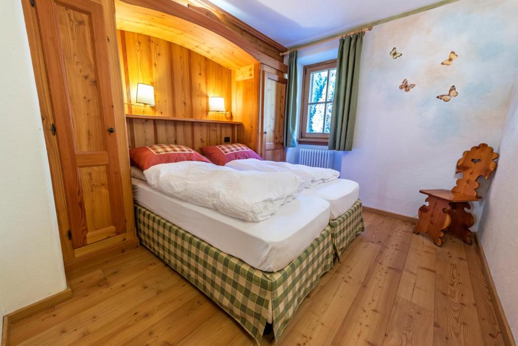 Postel nebo postele na pokoji v ubytování Rifugio Lago Nambino